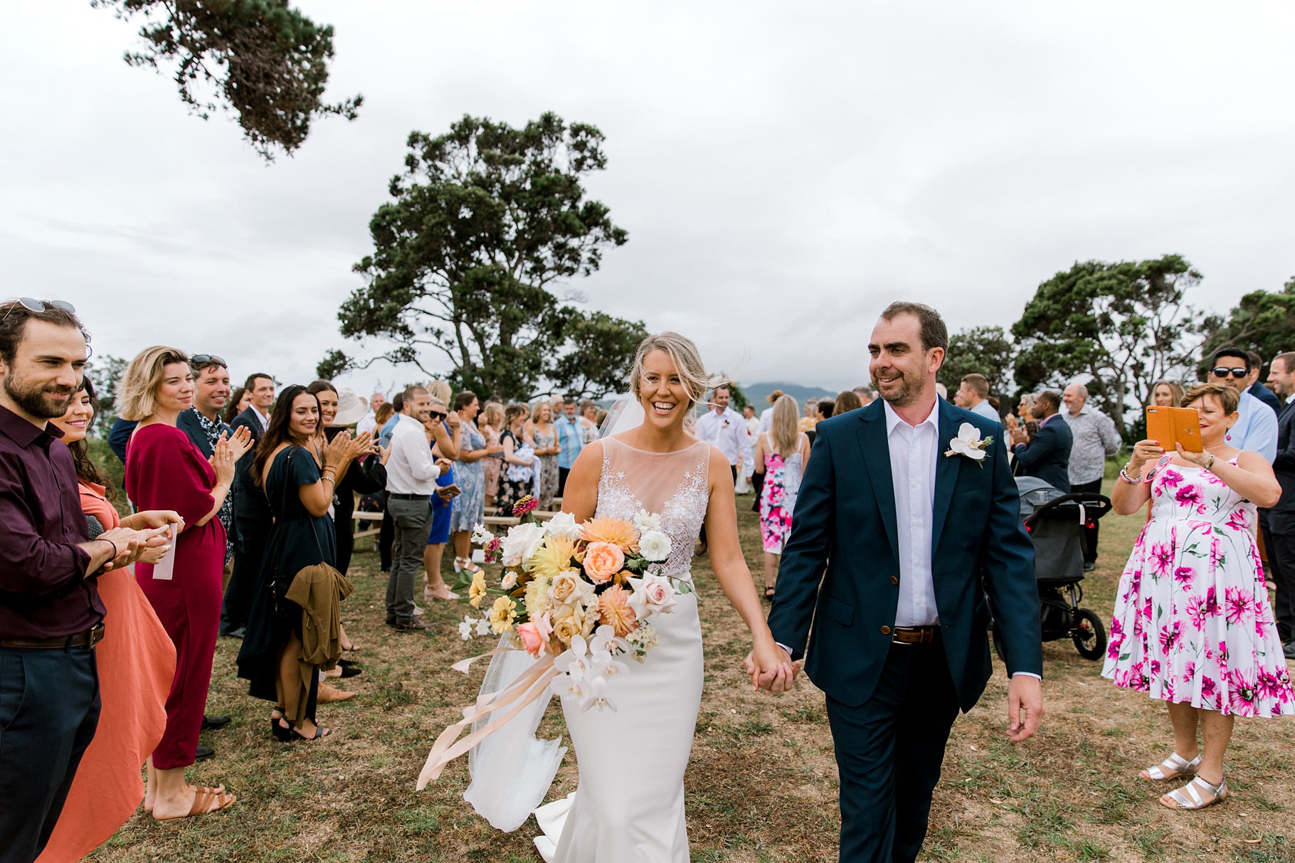 Auckland Wedding photographer, Officers Mess wedding photographer, Takapuna wedding photographer, Floral Stylist, Floral arch, blush bridesmaids dresses, rainy wedding