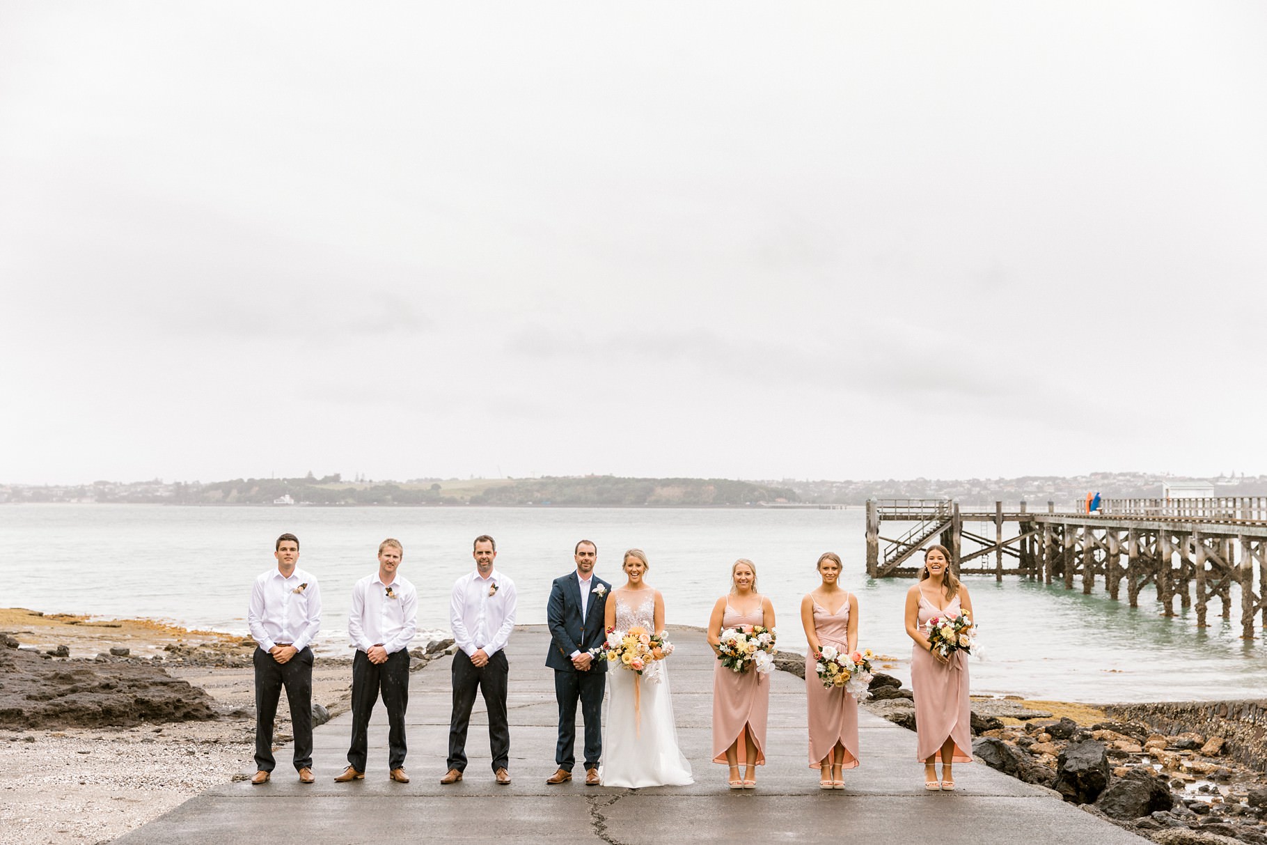 Auckland Wedding photographer, Officers Mess wedding photographer, Takapuna wedding photographer, Floral Stylist, Floral arch, blush bridesmaids dresses, rainy wedding